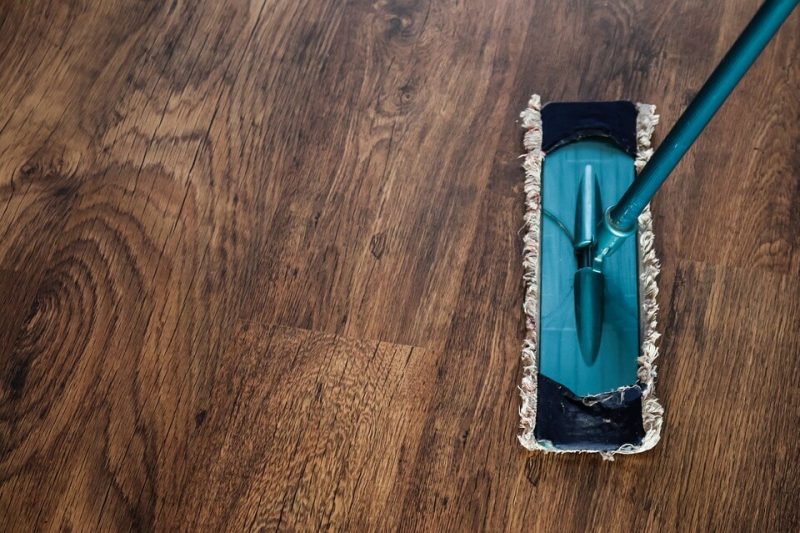 mop on brown wood floor