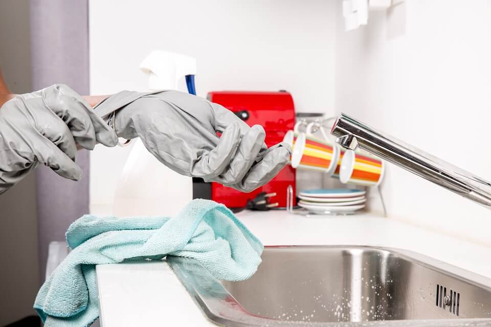 taking work gloves off in sink