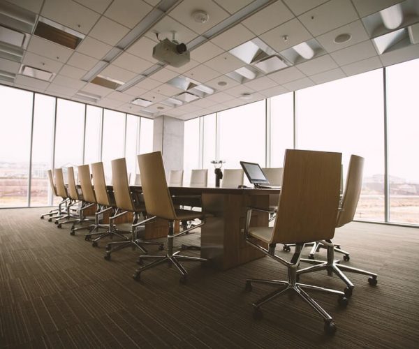 chairs around large table in office