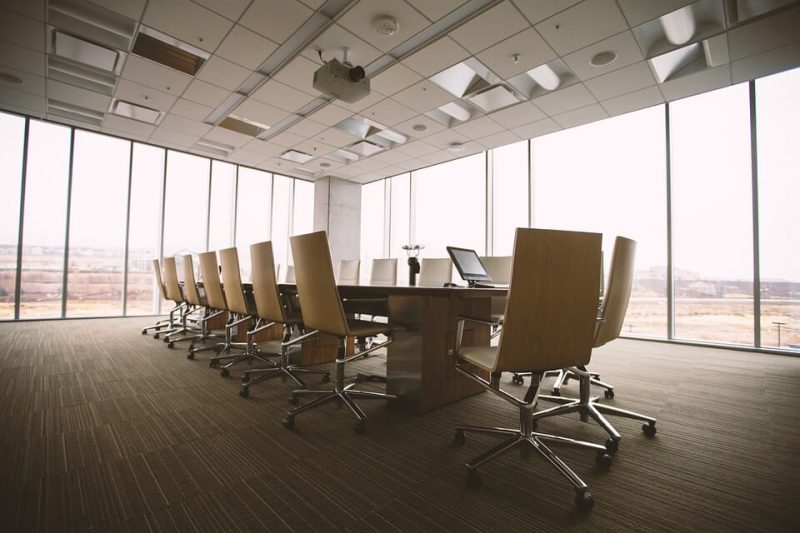 chairs around large table in office