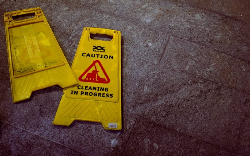 wet floor sign broken on the floor